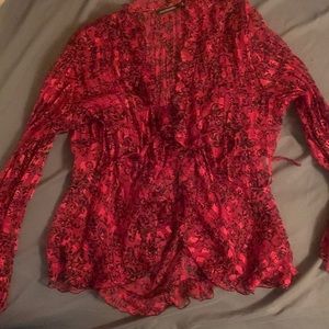 Sheer red blouse with black leaf pattern